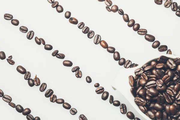 Coffee beans pattern with a coffee cup on top