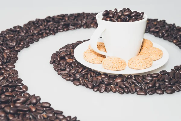Coffee cup and cookies in a coffee whirl