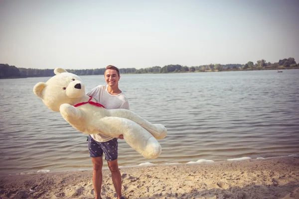 Guy with a big teddy bear