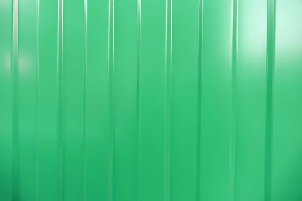 Corrugated iron is new. Texture color. Background green.