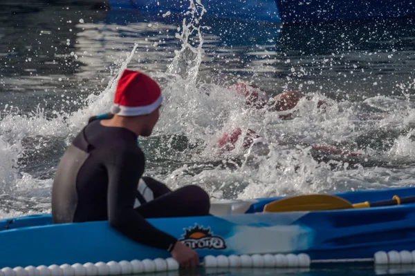 CHRISTMAS DAY HARBOUR SWIM 2015, BARCELONA, Port Vell - 25th December:Lifesavers watched for competitors