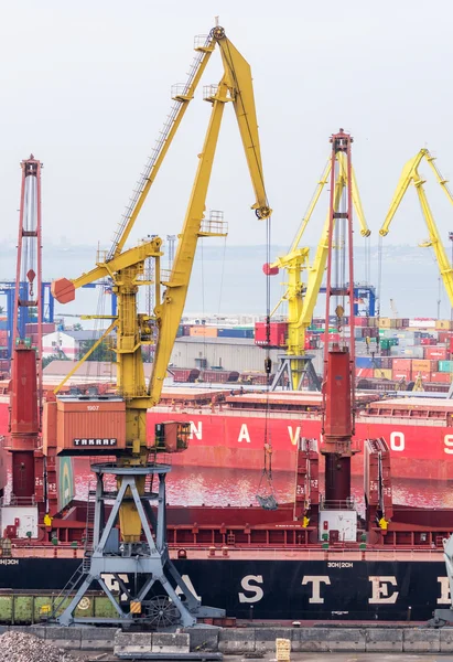 Industrial crane and cargo ships in Odessa Marine Trade Port