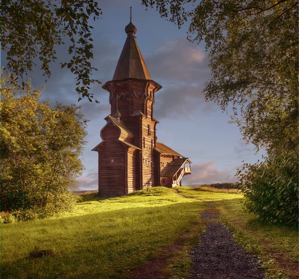 The wooden church of the Assumption of the Blessed Virgin Mary. The town of Kondopoga, Russia. Sunset. Autumn.