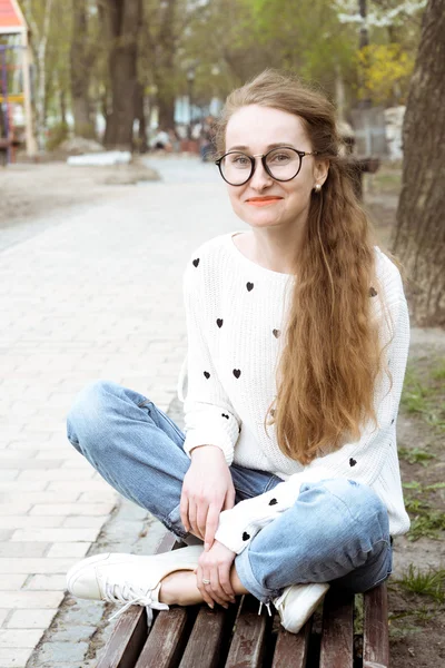 Young beautiful long-haired hipster girl.