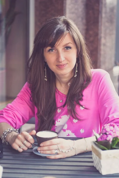 Beautiful Pretty Happy Young Woman drinking coffee.