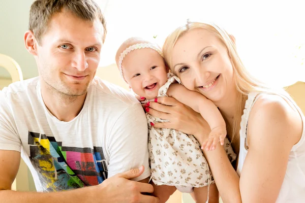 Happy young family spending time outdoors on a summer day.