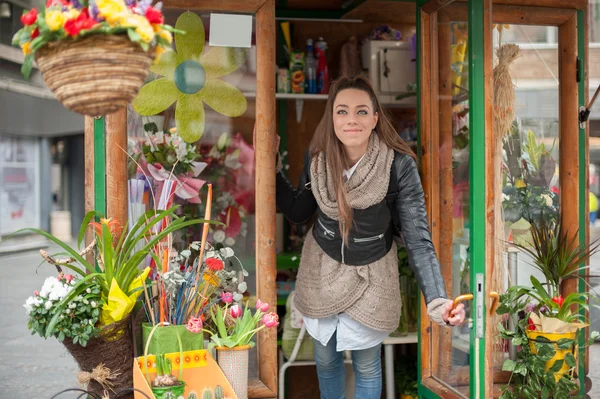 Young woman in the flower shop