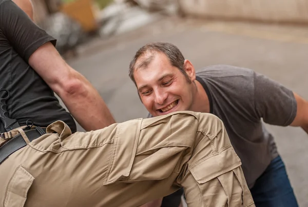 Knee strike to the head street fight