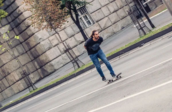 Skateboarder riding a skateboard slope on the city streets