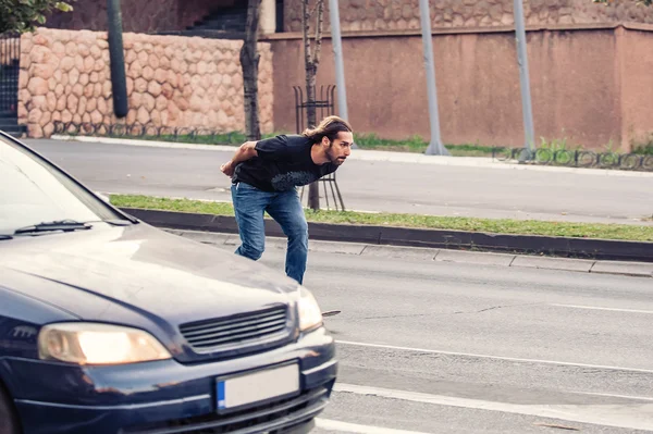Skateboarder riding a skateboard slope on the city streets