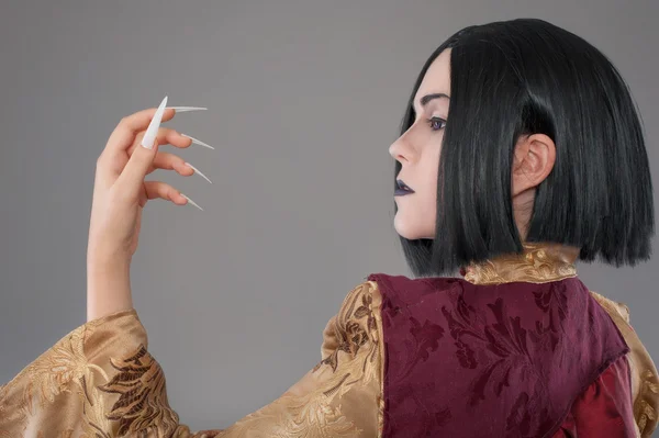 Gothic woman with chinese nails