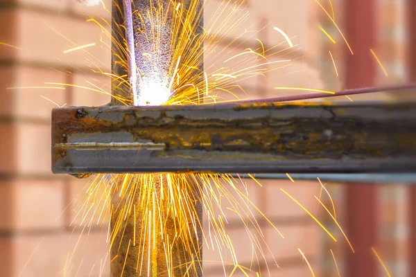 Welding sparks close up. Work welding machine. Metalwork.