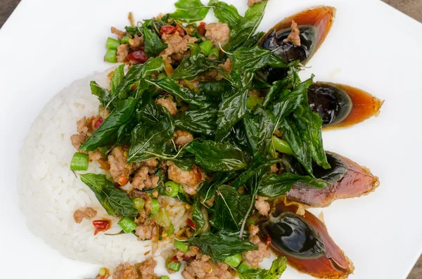 Fried basil with pork and preserved egg
