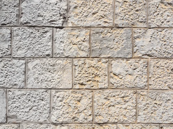 Natural stone wall to use as background or wallpaper