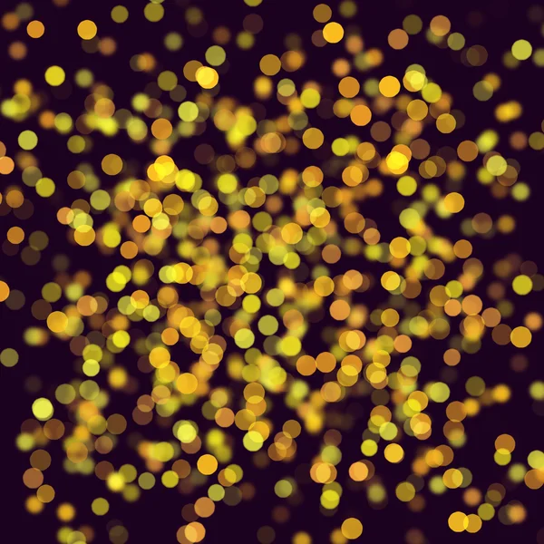 Gold glowing circles on a dark background. Abstract background.