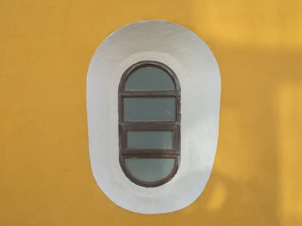 Oval window on a wall