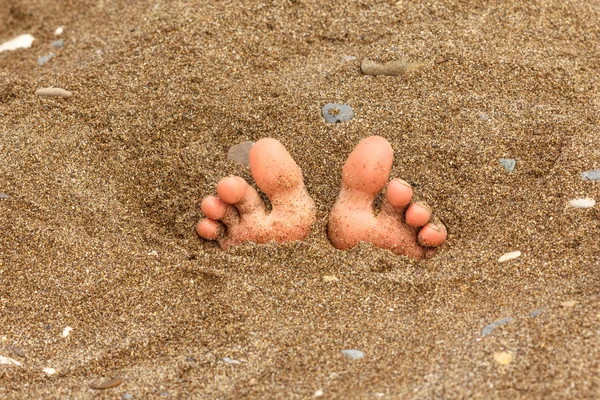 Foot on the sand, summer theme