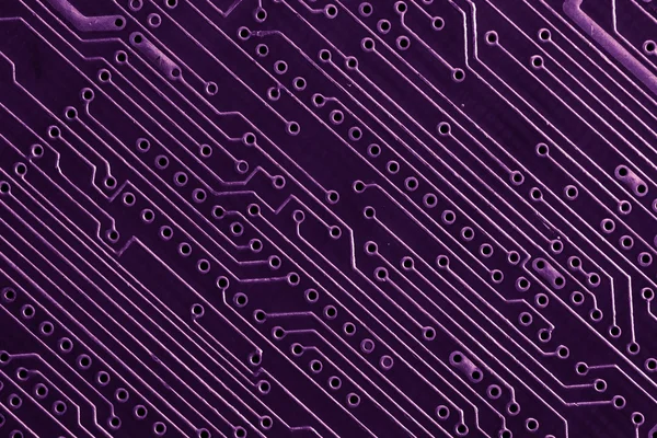 Purple circuit board close up.