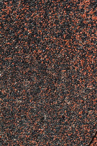 Abrasive texture roofing material close-up.