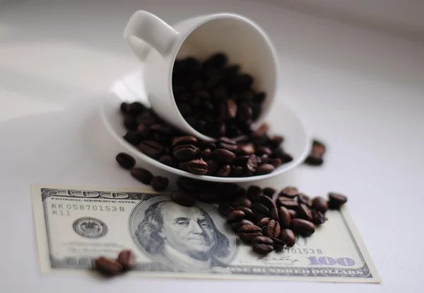 Dollars covered with coffee beans