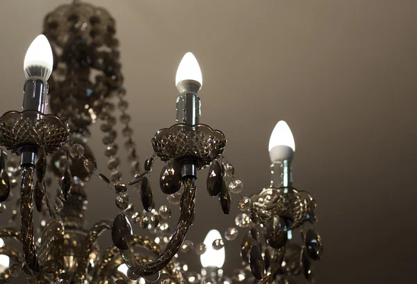 Brass chandelier with crystal.