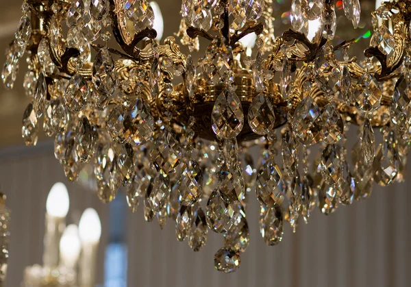 Brass chandelier with crystal.