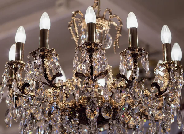 Brass chandelier with crystal.