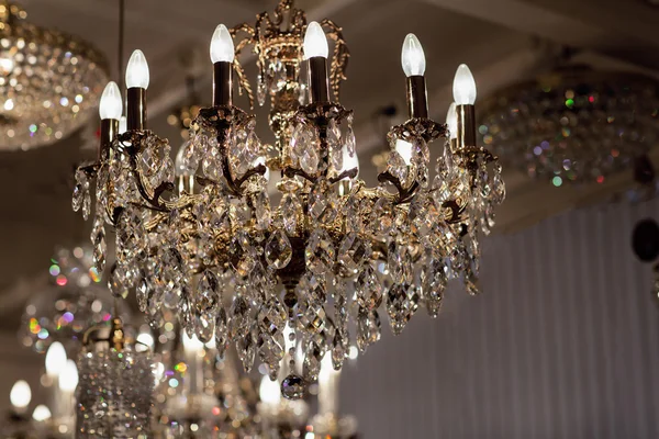 Brass chandelier with crystal.