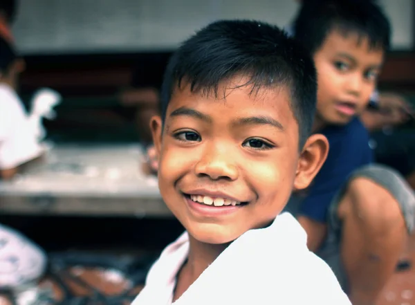 UBUD, INDONESIA - FEB 25, 2016:Unidentified Indonesian child.As of January 2015 the population of 3,891,428 people of Bali island.Indonesia includes numerous ethnic, cultural and linguistic groups.