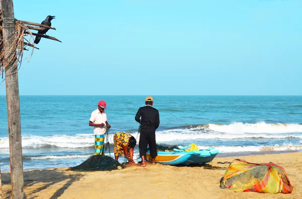 Sri-Lanka, Negombo, January 10, 2016- Negombo fishman  family near the  boat near ocean