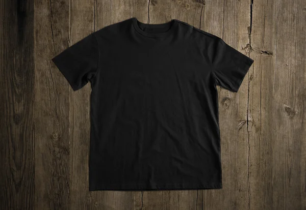 Black t-shirt on wooden background