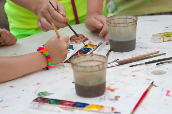 Children paint watercolor