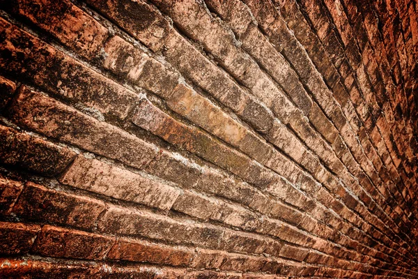Old grunge brick wall over dark border