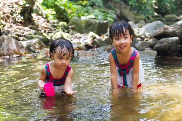 Asian Little Chinese Girls Playing in Creek