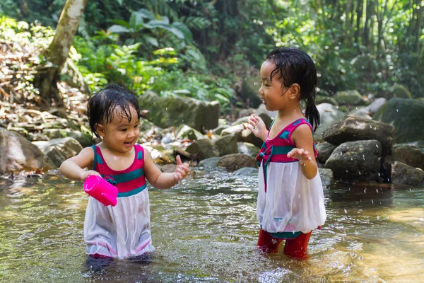 Asian Little Chinese Girls Playing in Creek