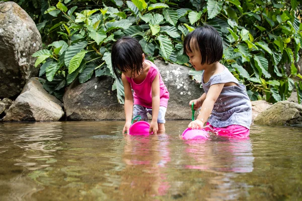 Asian Little Chinese Girls Playing in Creek