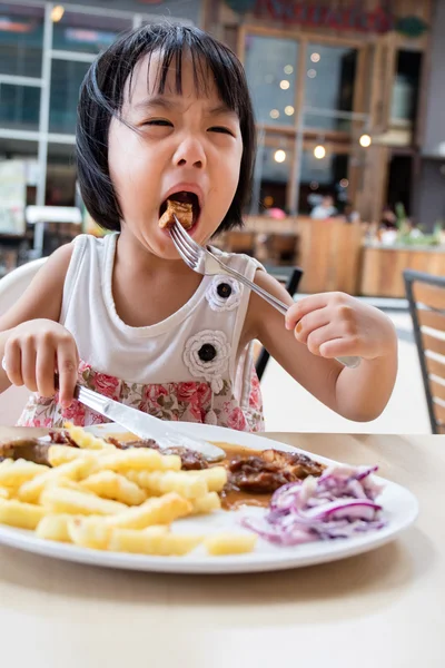 Asian Little Chinese Girl Eating Western Food