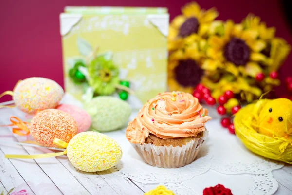 Close up image on set of cake, colorful eggs and gift decorations