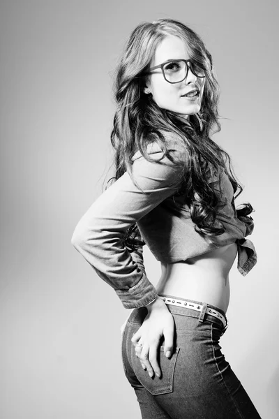 Image of young trendy pretty lady wearing hipster glasses, black and white photography