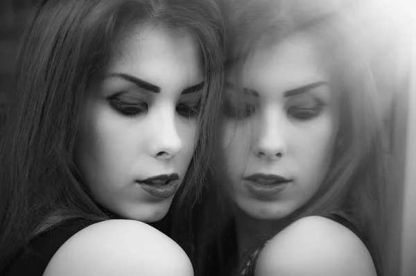 Black and white photography portrait of beautiful elegant sensual young lady having fun happy relaxing over mirror