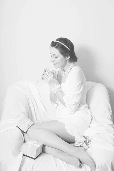 Black and white photography of elegant beautiful young lady having fun holding cup of drink happy smile on copy space background