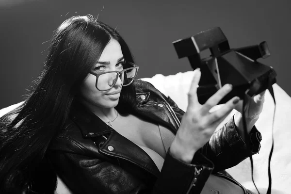 Picture of beautiful glamour girl in leather jacket having fun making selfy picture