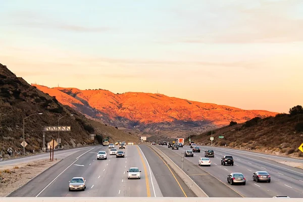 Cars on the highway with beautiful mountain view in California, USA