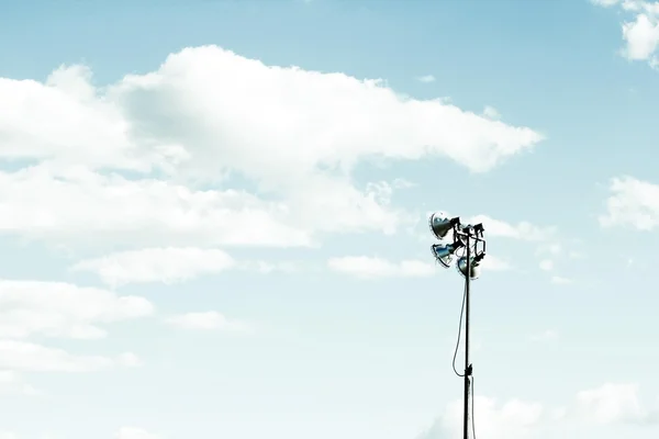 LED stadium light with cloudy blue sky