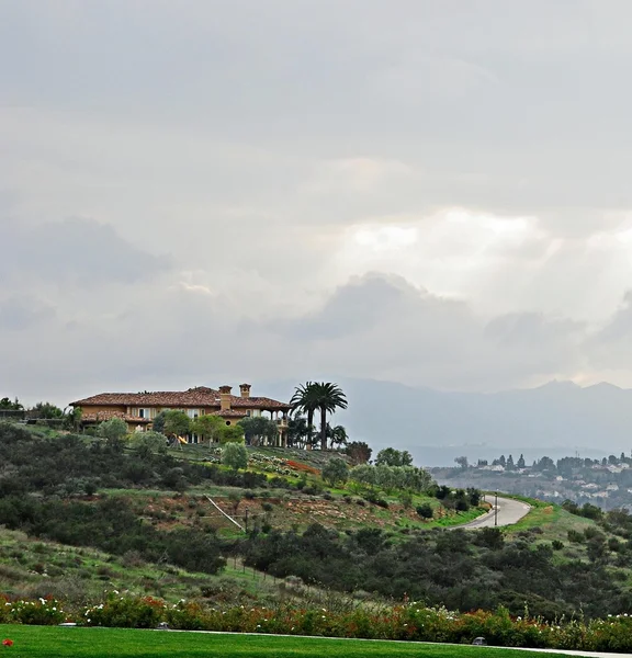 Landscape with house on hill