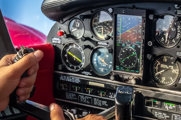 Hands on Stick in Aircraft Cabin During Cruise Flight