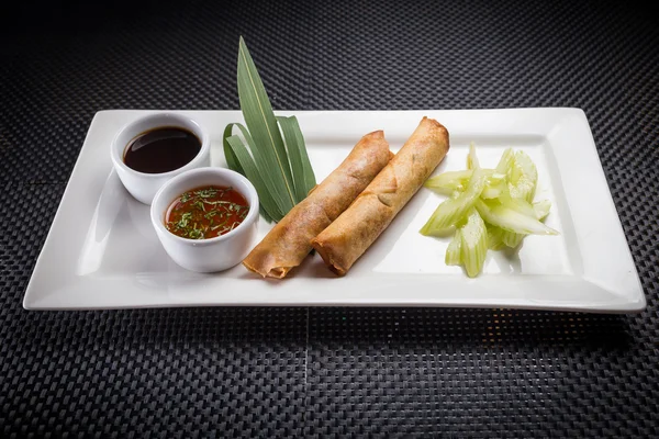 Spring rolls with shrimp on white plate