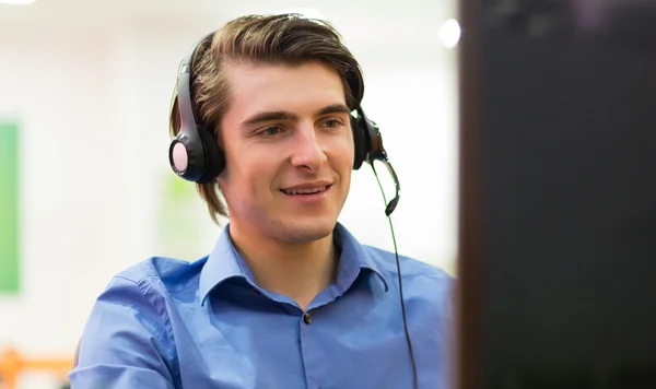 Portrait of confident male customer service representative with