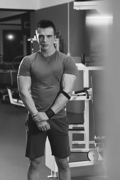 Handsome man exercising at gym - workout