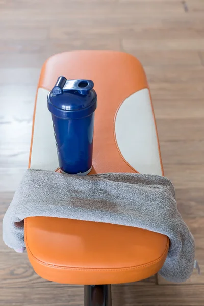 Family sport or weight loss concept. Dumbbells, towel and shaker